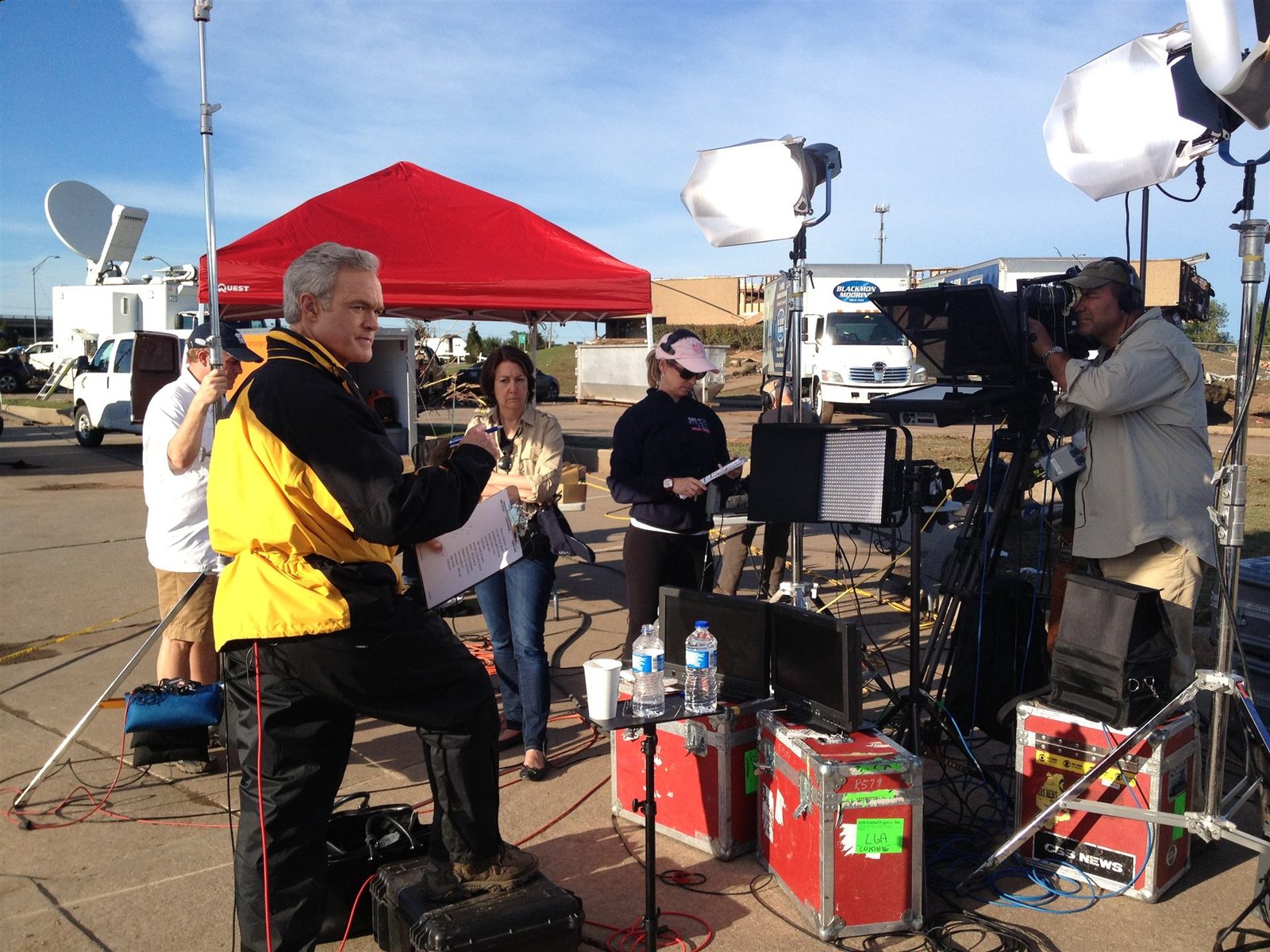 Guy Campanile and a CBS News field production crew on location covering a story