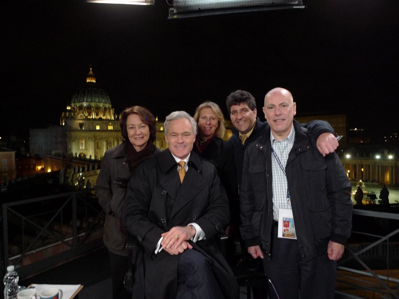 Guy Campanile and CBS News crew reporting live from a rooftop overlooking St. Peter's Basilica during a papal conclave
